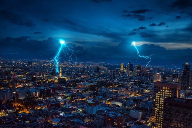 lightning striking at night in the city