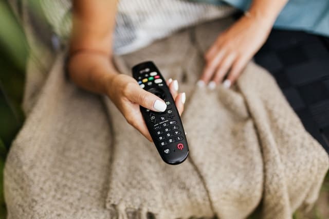 person holding a remote