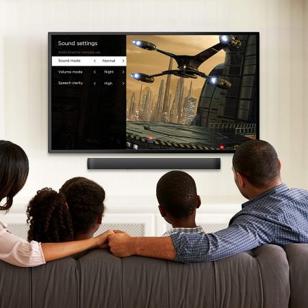 Family watching the tv with audio from Roku Smart Soundbar