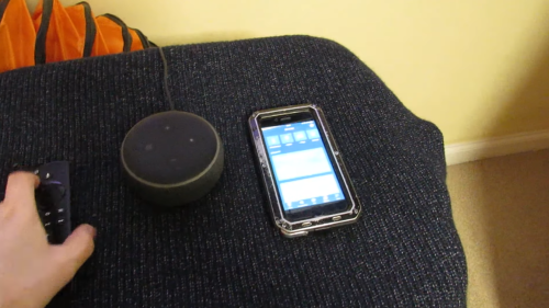 Amazon Echo Dot, cellphone and remote