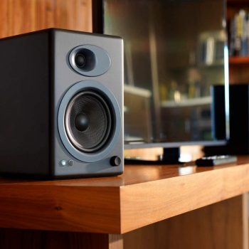 Audioengine A5+ (Plus) Powered Speaker beside a tv on a table