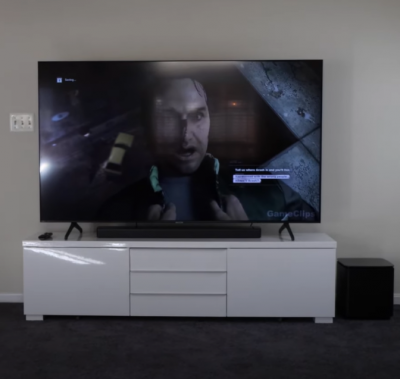 Bose Soundbar 700 and tv on white cabinet