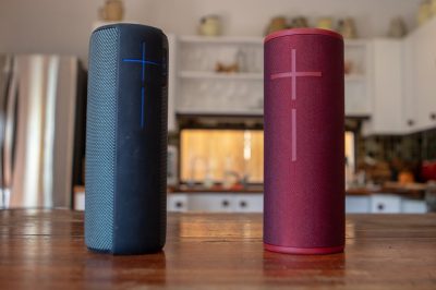 Blue and red portable speakers in a living room set up