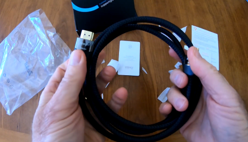 holding HDMI cable