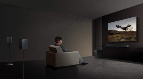 man watching TV while using Samsung soundbar