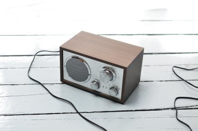 brown radio speaker on a wooden surface