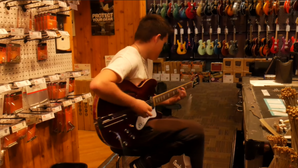 playing a guitar in a store