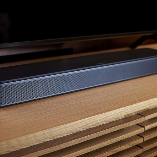 Bose TV speaker close up shot in wooden shelf