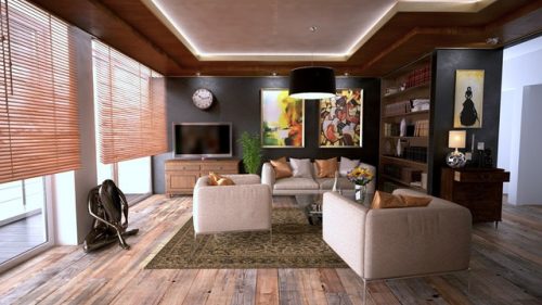 spacious brown living room with sofa and TV